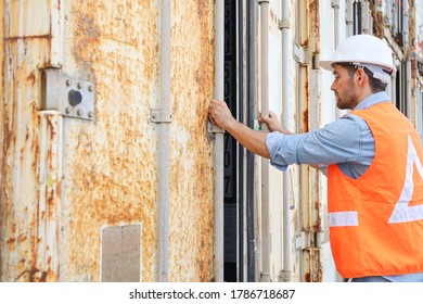 A engineering or foreman is working at container stock yard, radio mobile talking communication with crane loader or forklift for transport control handling and open the box