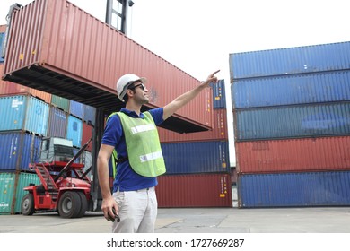 Engineering group working and they are loading container for support logistics and import export business