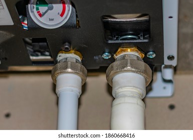 Engineering Heating Systems For Houses. Close-up Of Gas Boiler Piping Nodes With Ball Valves And Pressure Gauge.