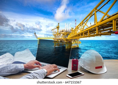 Engineering Industry Concept In Office With Offshore Oil And Gas Rig Platform With Beautiful Sky In The Gulf Of Thailand.