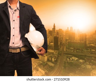 Engineering Man And Sun Light Behind Urban Construction Background Use For Land Development Theme