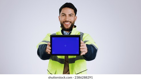 Engineering man, tablet green screen and presentation for renovation, architecture and design software in studio. Portrait of construction worker with digital technology mockup on a white background - Powered by Shutterstock