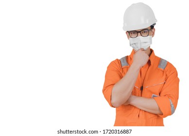 Engineering Man Who Is Confident And Smart Wearing Coveralls Suit, Helmets, And Medical Mask During Work In The Offshore Oil Rig For Protection From Covid-19 (coronavirus) Outbreak