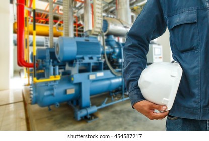 The Engineering And Safety Helmets Stood On The Details Of Industrial Compressor Refrigeration Station At Manufacturing Factory.