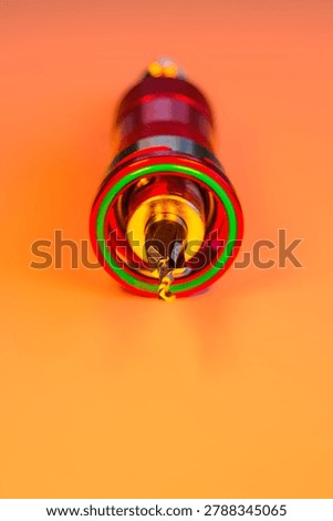 Engineering Series : Close up of a pilot drill with countersink bit set in a quick release holder under vibrant RGB lighting. This industrial tool showcases mechanical innovation, precise woodworking engineering and the beauty of human ingenuity.
