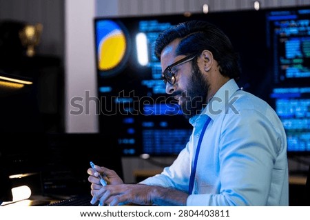 Engineering specialist evaluating AI model inference performance against real time code logs on a collaborative high resolution display.