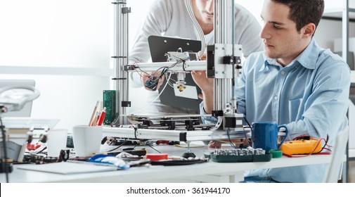 Engineering students using an innovative 3D printer in the laboratory - Shutterstock ID 361944170