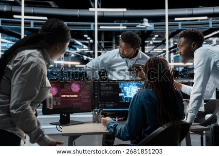 Engineering team in AI server hub work together to defend against hacker attack stealing sensitive data. Artificial intelligence data center teamworking colleagues fight virus during security breach