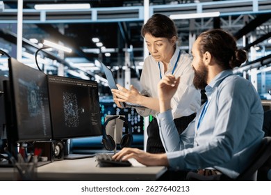 Engineering team doing brainstorming in server hub, using AI powered tech to run simulations. Data center coworkers cooperating, coding algorithms to extract insights from data and automate rigs