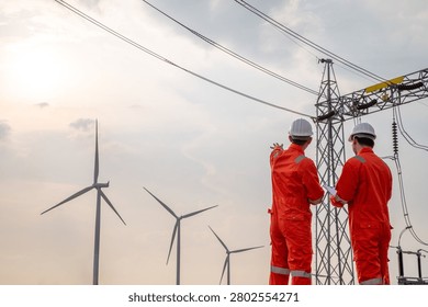 Engineering Team Inspecting Wind Power Generation and Electrical Transmission Network Infrastructure