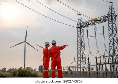 Engineering Team Inspecting Wind Power Generation and Electrical Transmission Network Infrastructure
