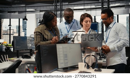 Engineering team working in AI startup training predictive models for language processing tasks. Artificial intelligence tech specialists use technical expertise for complex IT requirements, camera A