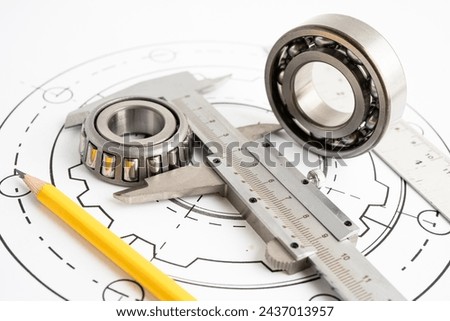 Engineering tools and mechanical industrial with vernier caliper and metal ball bering.