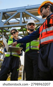 Engineering view of large-scale industrial process pipelines with metallic thermal insulation, highlighting complex pipe rack integration and structural steel supports at an energy facility.
