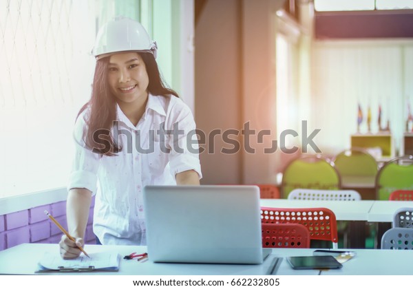 Engineering women working Engineering workplace -\
Engineering project, blueprints, ruler, calculator, laptop and\
divider compass. Construction concept. Engineering .selective\
focus