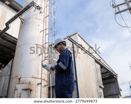 Engineering work using digital tablet maintenance Exhaust system concept Clean air environmental protection. Factory industrial manufacturing. Sustainable future environment air pollution reduction