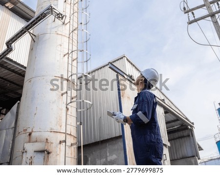Engineering work using digital tablet maintenance Exhaust system concept Clean air environmental protection. Factory industrial manufacturing. Sustainable future environment air pollution reduction