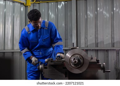 Engineering Worker Man African American Wearing Uniform Safety Working Machine Lathe Metal Brake Disc Grinder In Factory Industrial, Worker Manufacturing Industry Concept.