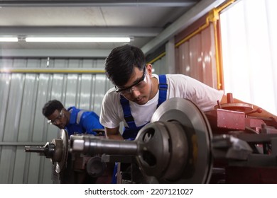 Engineering Worker Man Wearing Uniform Safety Working Machine Lathe Metal Brake Disc Grinder In Factory Industrial, Worker Manufacturing Industry Concept.