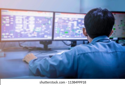 Engineering Works With The Tablet In The Production Control Room.Control Room Of A Steam Turbine,Generators Of The Coal-fired Power Plant For Monitor Process, Business And Industry Concept