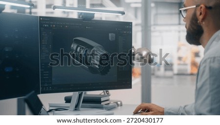 Engineers Analyzing Complex Engine Model on Monitor. Man and Woman Engineering Team Collaborating Over Large Monitor Displays Detailed 3D Model of Mechanical Part. Concept of Collaborative 3D Design.
