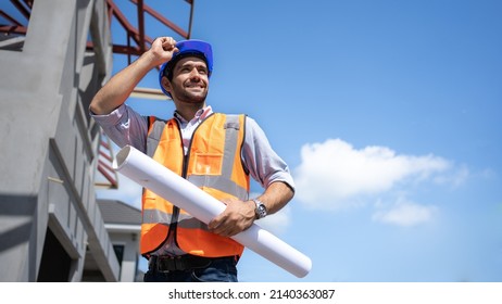 Engineers, Architects, Managers handsome middle eastern face holding a blueprint Construction of houses and buildings with confidence construction background.Free space banner,blue sky ,hard hat,vest. - Powered by Shutterstock