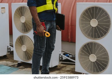 Engineers are checking the air conditioning and cooling system in a commercial building.	