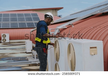 Engineers are checking the air conditioning and cooling system in a commercial building.