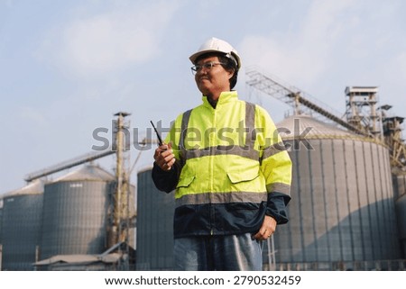 Engineers are checking the working system of a fresh food factory producing ducks, chickens and pork outside the building.