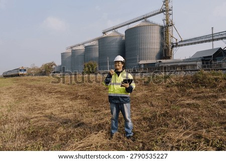 Engineers are checking the working system of a fresh food factory producing ducks, chickens and pork outside the building.