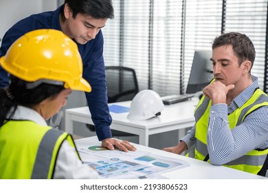 Engineers And Competent Employer Discussing Plans And Blueprints Together With Tablet In The Office. Concept Of Team Contribution Of Ideas For Engineering Project.