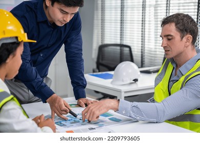 Engineers And Competent Employer Discussing Plans And Blueprints Together With Tablet In The Office. Concept Of Team Contribution Of Ideas For Engineering Project.