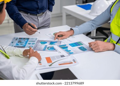 Engineers And Competent Employer Discussing Plans And Blueprints Together With Tablet In The Office. Concept Of Team Contribution Of Ideas For Engineering Project.