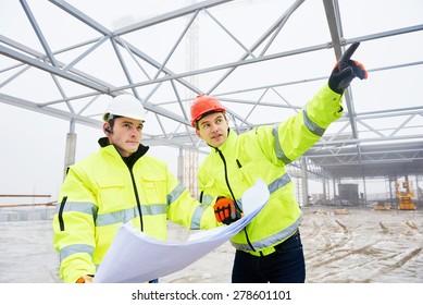 engineers construction foreman managers outdoors indoors at building site with blueprints