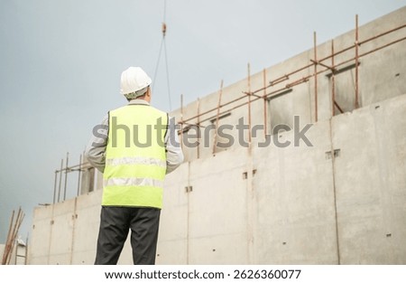 Engineers construction projects inspect and supervise the construction of building walls and foundations of residential buildings