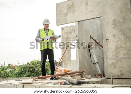 Engineers construction projects inspect and supervise the construction of building walls and foundations of residential buildings