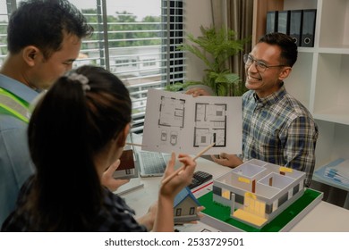 Engineers and contractors collaborate to solve problems that arise in design and construction, architects meets in the office to analyze the design structure to ensure it meets the client's wants.