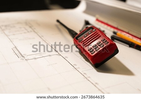 Engineers and crane.smiling dock worker holding radio and ship background.radio and ship background