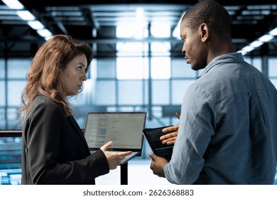 Engineers in data center using devices, employing machine learning models, analyzing historical usage patterns, predicting future infrastructure needs, allocating resources efficiently - Powered by Shutterstock - Get 15% off with code: PIKWIZARD15