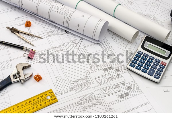 Engineer\'s drawing background for different tools\
on table
