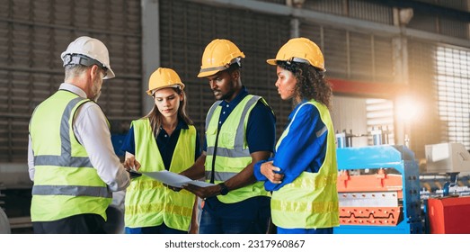 Engineers or foreman inspecting and check up machine at factory machines. Worker industry working in the metal sheet company.  - Powered by Shutterstock