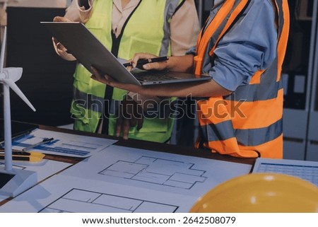 Engineers are helping to design work on blueprints and collaborate on structural analyzing of project types.