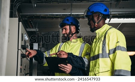 Engineers inspected the electrical switchboard and verified the operational voltage range.	Technician setting electrical in inverter solar panel room