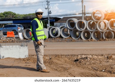 Engineers are inspecting the readiness and completeness of a large construction project involving pipe laying and road construction.Civil engineer,construction,roadconstruction,engineer,drainage pipe.