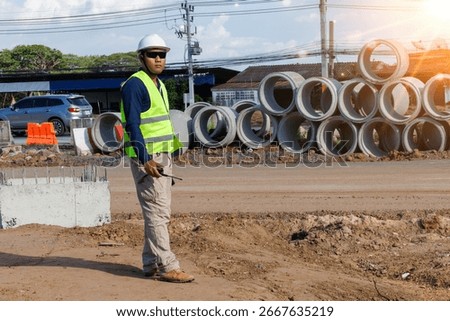 Engineers are inspecting the readiness and completeness of a large construction project involving pipe laying and road construction.Civil engineer,construction,roadconstruction,engineer,drainage pipe.