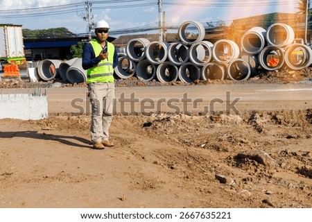 Engineers are inspecting the readiness and completeness of a large construction project involving pipe laying and road construction.Civil engineer,construction,roadconstruction,engineer,drainage pipe.