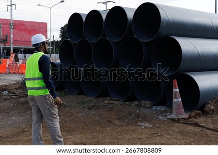 Engineers are inspecting the readiness and completeness of a large construction project involving pipe laying and road construction.Civil engineer,construction,roadconstruction,engineer,drainage pipe.