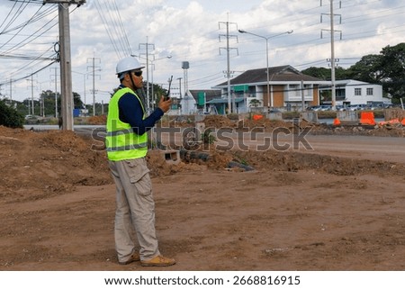 Engineers are inspecting the readiness and completeness of a large construction project involving pipe laying and road construction.Civil engineer,construction,roadconstruction,engineer,drainage pipe.