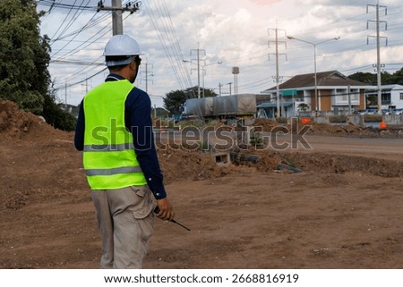 Engineers are inspecting the readiness and completeness of a large construction project involving pipe laying and road construction.Civil engineer,construction,roadconstruction,engineer,drainage pipe.