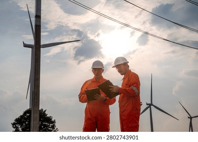 Engineers Inspecting Wind Farm and Electrical Substation Infrastructure for Renewable Energy Operations